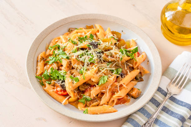 istock Pasta caponata on a plate close up 1070882570