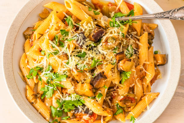 istock Pasta caponata on a plate close up 1070883272