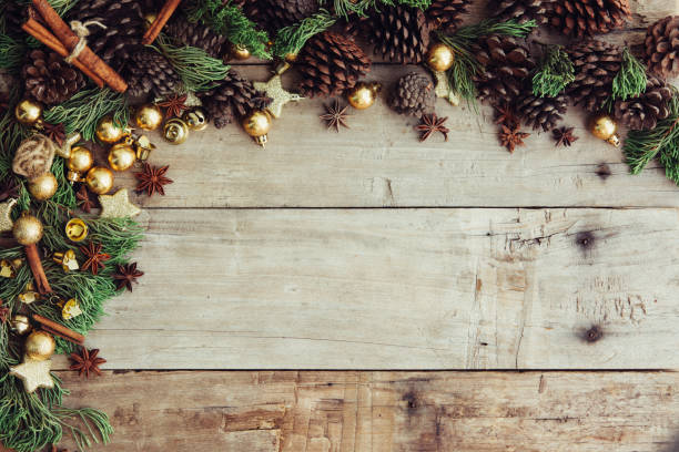 istock Christmas background with decorations and gift boxes on the wooden table. 1070889700