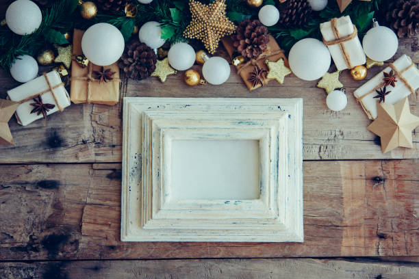 istock Christmas background with decorations and gift boxes on the wooden table. 1070889798