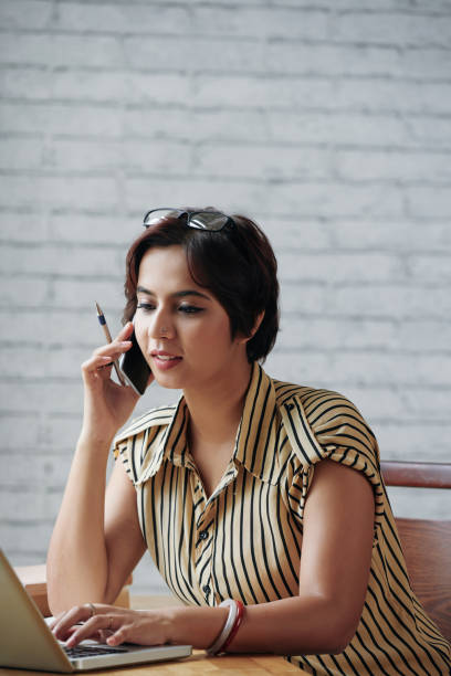 istock Indian woman working in office 1070894440