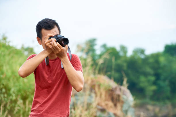 istock Traveler taking photos 1070895770