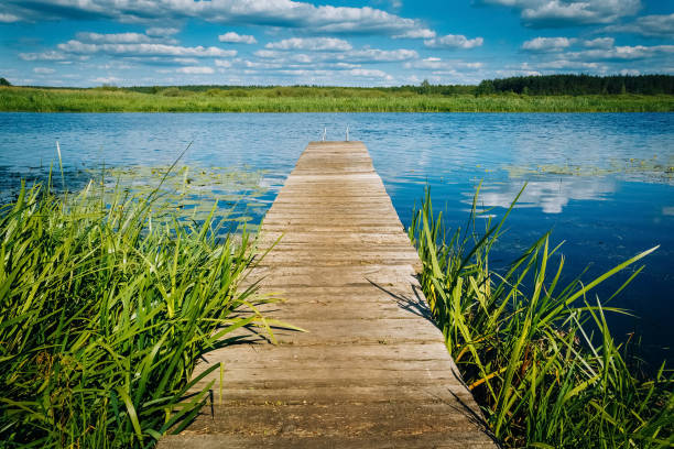 istock River landscape wooden pier. Horizon 1070896740