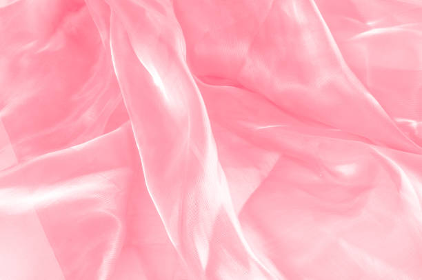 istock Background texture, pattern. Cloth pink silk. Smooth elegant pink silk or satin can use as wedding background. Luxurious valentine day background design. 1070899676