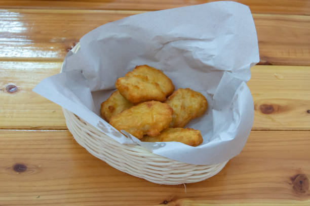 istock Fried chicken nuggets in a Basket on a wooden table. 1070901906