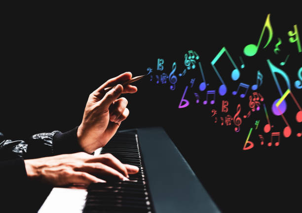 male songwriter hands composing a song on piano. song writing, music education concept male songwriter hands composing a song on piano. song writing, music education concept composer stock pictures, royalty-free photos & images