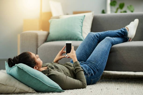 istock Texting my friends to come check out my new place 1070911124