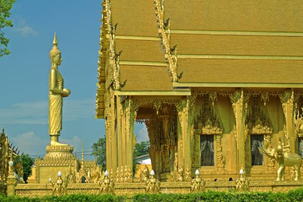 istock Buddha statue Facing the golden church bright day. 1070912596