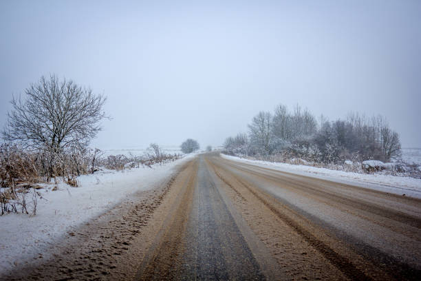 istock winter snowy road. snow lies near the road. 1070914708
