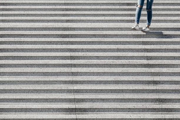istock View on stairs in a modern district with a girl. Abstract minimal background. 1070917320