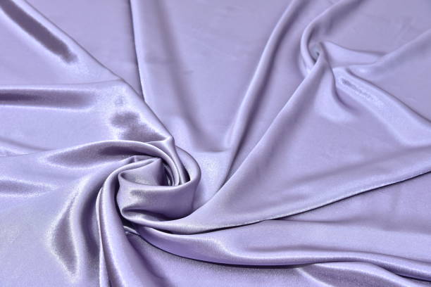 istock Beautiful smooth elegant wavy violet purple satin silk luxury cloth fabric texture, abstract background design. Card or banner. 1070917640