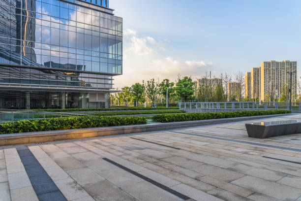istock modern building and empty pavement at dusk, china 1070918384