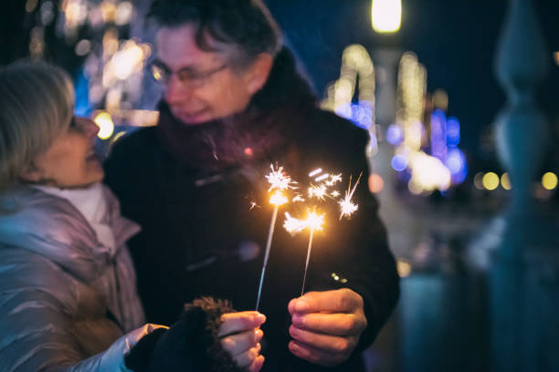 istock Senior couple with sparklers 1070924086