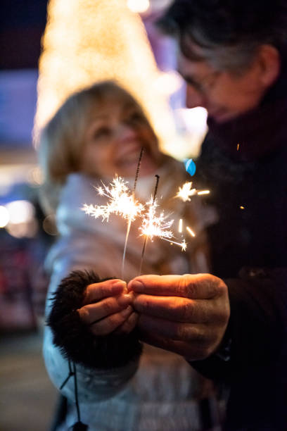 istock Senior couple with sparklers 1070924118