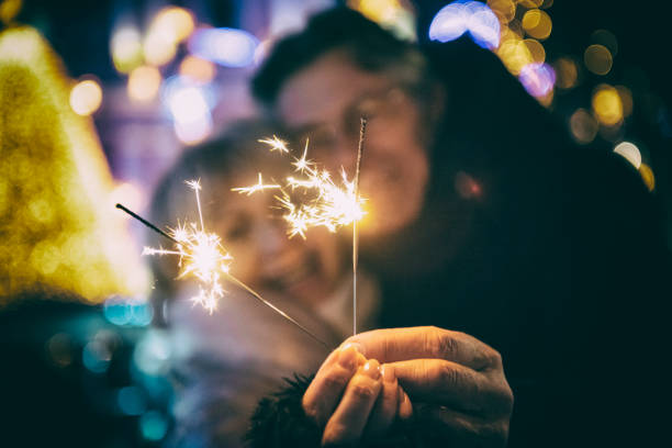 istock Senior couple with sparklers 1070924124