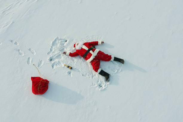 istock Drunk santa claus lying on the snow 1070928374