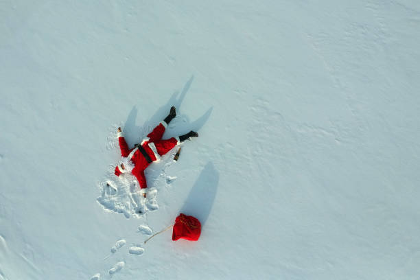 istock Drunk santa claus lying on the snow 1070928376
