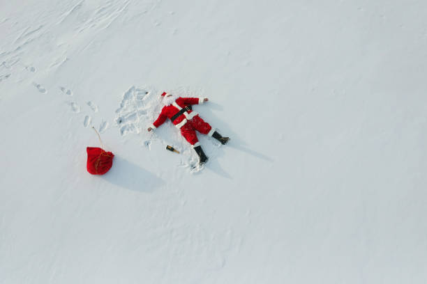 istock Drunk santa claus lying on the snow 1070928380
