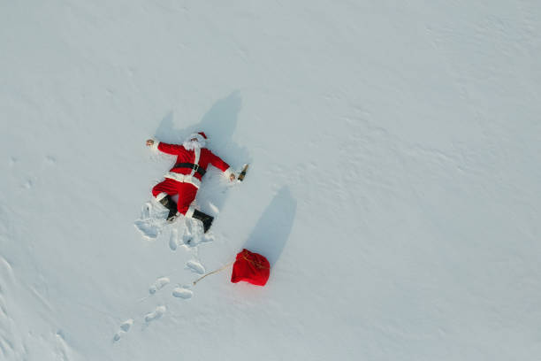 istock Drunk santa claus lying on the snow 1070928386