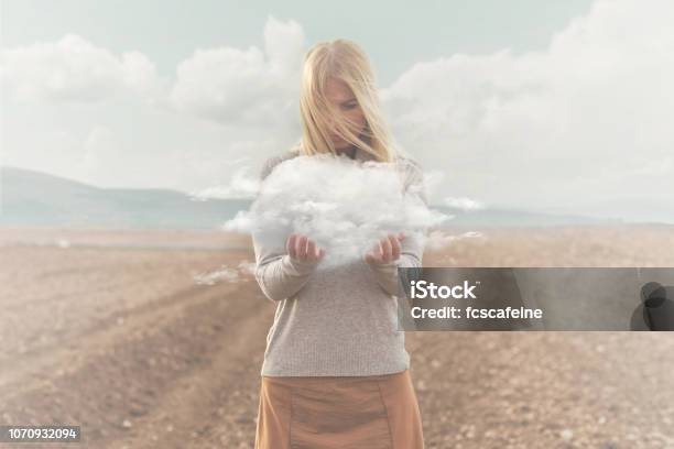 Surreal Moment Woman Holding In Her Hands A Soft Cloud Stock Photo - Download Image Now