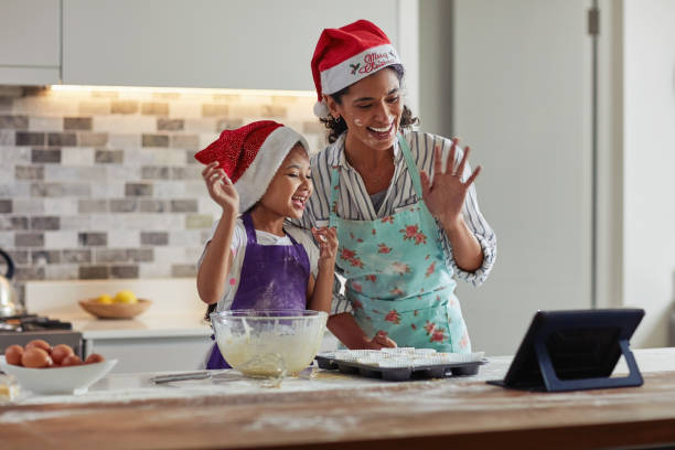 We're ready for Christmas! Cropped shot of a mother and daughter spending quality time while baking at home lens flare offspring daughter human age stock pictures, royalty-free photos & images