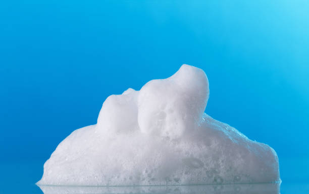 istock Big beautiful fragrant soap foam on bright blue background 1070942814