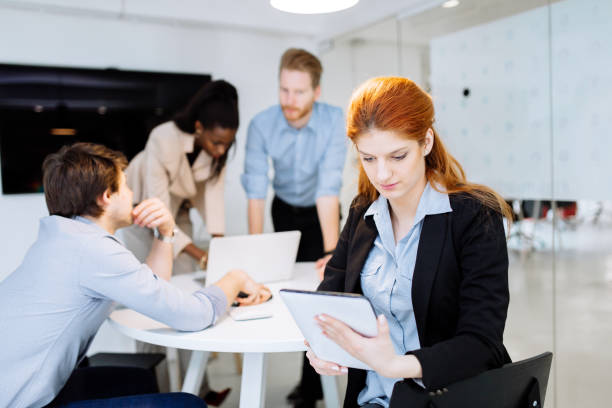 istock Business people collaborating in office and working on project together 1070943860