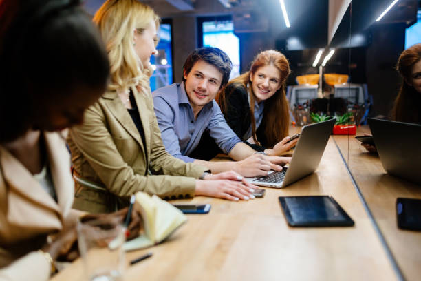 istock Business people collaborating in office and working on project together 1070943980