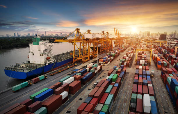 istock Logistics and transportation of Container Cargo ship and Cargo plane with working crane bridge in shipyard, logistic import export and transport industry background 1070944014