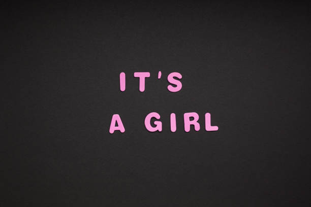istock It's a girl writing on black paper background 1070944096
