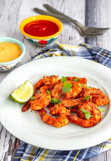 Thai spiced grilled shrimp / prawn with condiments and lemon