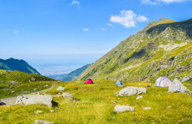 The Transfagarasan road. Tents on Transfagarasan road pass, Romania. balea lake romania stock pictures, royalty-free photos & images