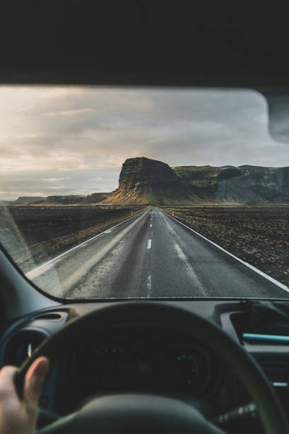 istock Man driving car in Iceland 1070949326