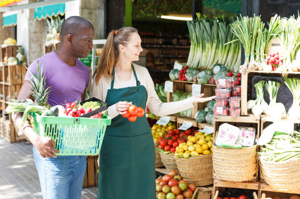 istock Man is asking from seller about fruits 1070952150