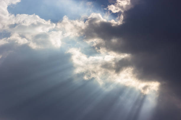 istock Dramatic blue sky with beautiful clouds and sun rays in the evening 1070952152