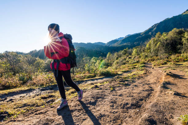 istock Young woman hikes on trail in the mountains 1070952802