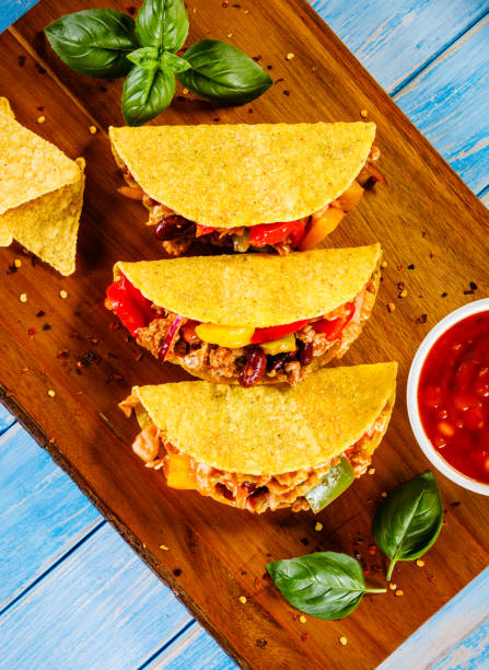 istock Tacos on cutting board on wooden table 1070953078