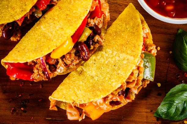 istock Tacos on cutting board on wooden table 1070953344
