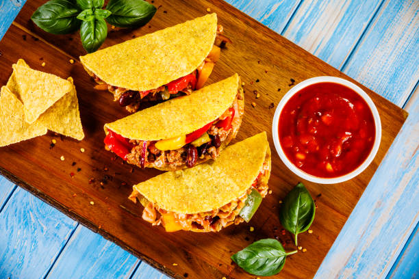istock Tacos on cutting board on wooden table 1070953472