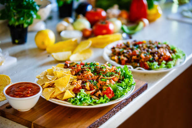 istock Kebabs - grilled meat, chips and vegetables on wooden background 1070954810