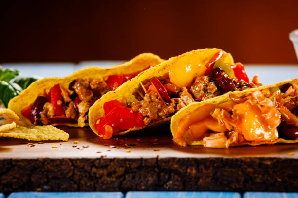 istock Tacos on cutting board on wooden table 1070955254