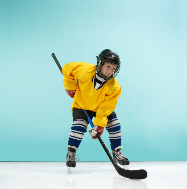 istock A hockey player with equipment over a blue background 1070955330