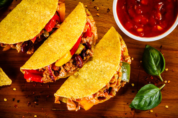 istock Tacos on cutting board on wooden table 1070955584