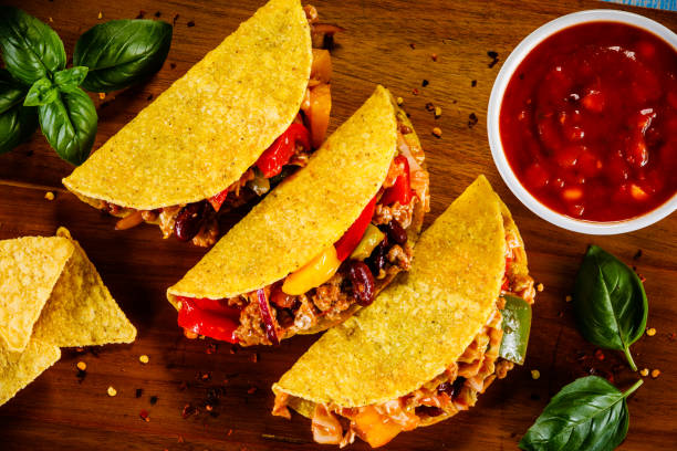 istock Tacos on cutting board on wooden table 1070956250