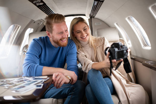 istock Rich young tourist couple taking a selfie inside a private jet 1070957616