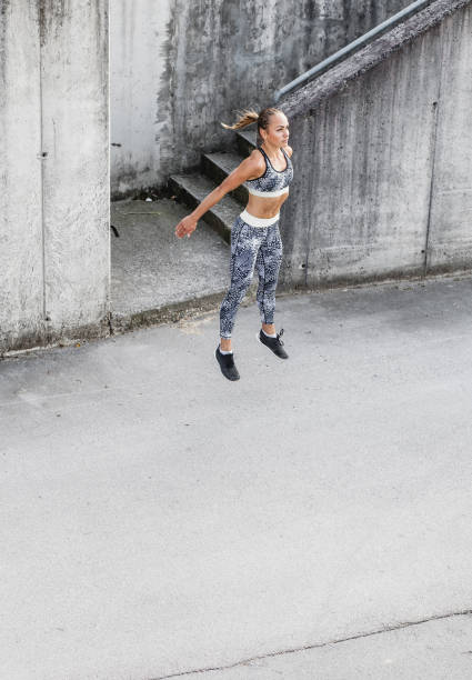istock Young Woman Exercising in an Urban Environment 1070960356