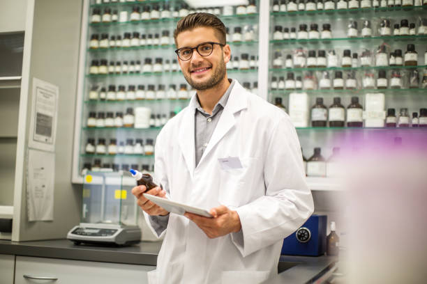 istock Happy male apothecary at pharmacy 1070960384