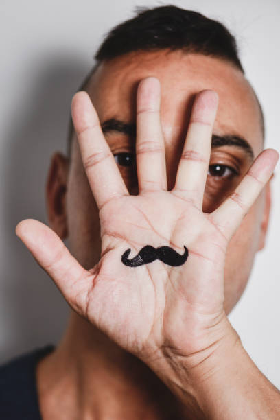 istock man with a mustache painted in his palm 1070960984