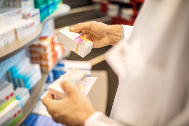istock Chemist examining the medicines at drugstore 1070962892