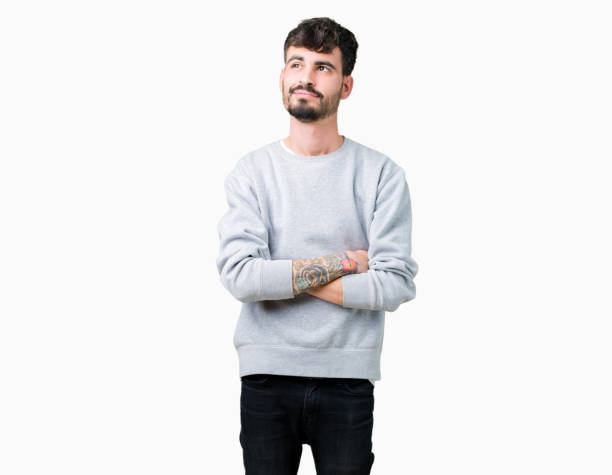 istock Young handsome man wearing sweatshirt over isolated background smiling looking side and staring away thinking. 1070964844